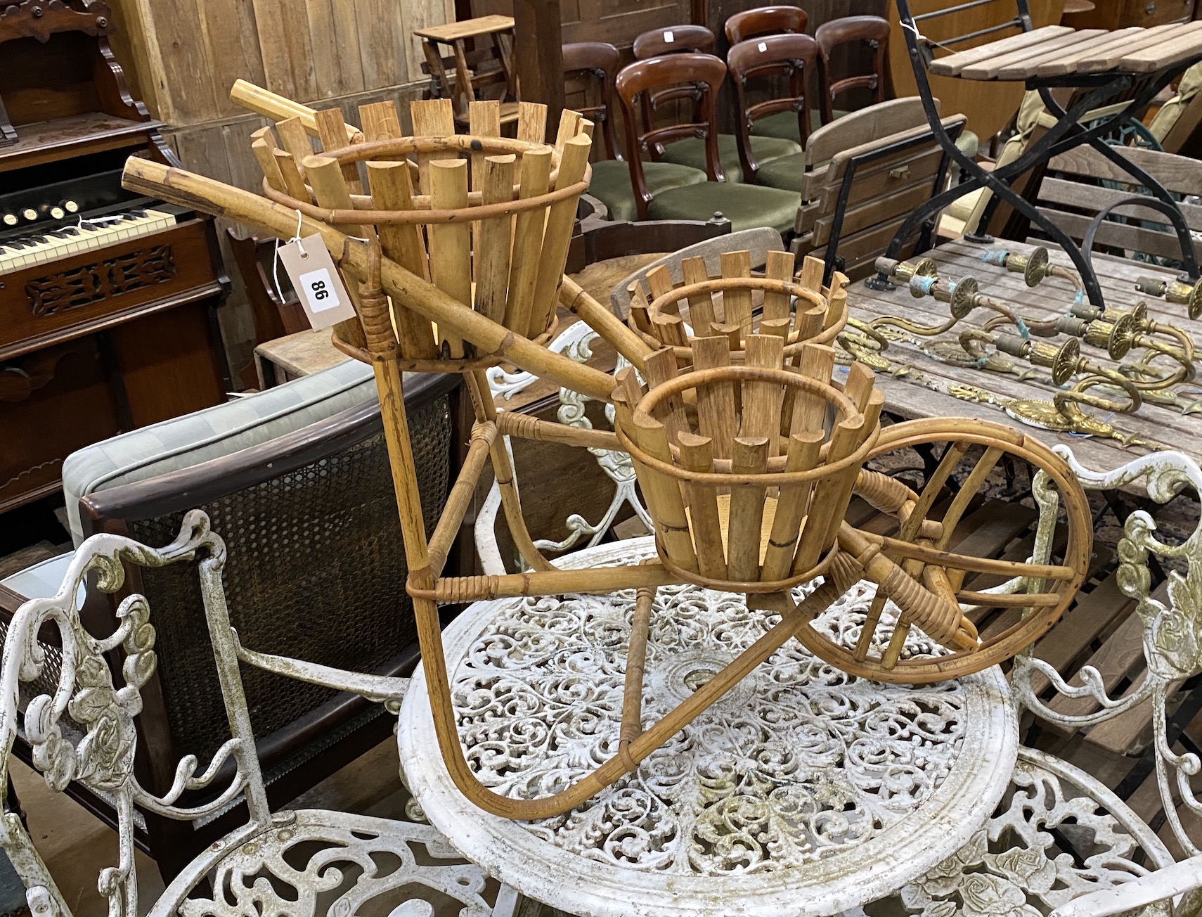 A bamboo wheelbarrow pot stand, height 64cm